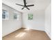 Bright bedroom featuring neutral walls, tile floors, and a ceiling fan at 741 Prince Ave, Marietta, GA 30062