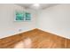 Cozy bedroom featuring a large window, hardwood floors, and neutral paint at 741 Prince Ave, Marietta, GA 30062
