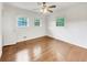 Bright bedroom featuring hardwood floors, neutral walls, and a ceiling fan at 741 Prince Ave, Marietta, GA 30062