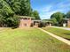 Charming two-story home featuring a well-maintained lawn and a welcoming walkway to the front door at 741 Prince Ave, Marietta, GA 30062