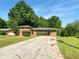 Charming two-story home featuring a long driveway and shrubbery at the front of the house at 741 Prince Ave, Marietta, GA 30062