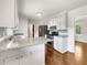 Modern kitchen boasts granite countertops, stainless steel appliances, and white cabinetry at 741 Prince Ave, Marietta, GA 30062