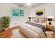 Serene bedroom with a modern headboard, stylish bedside tables, and a calming color palette at 741 Prince Ave, Marietta, GA 30062