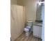 Bathroom featuring a toilet, granite vanity, and shower with curtain at 6258 Crooked Creek Dr, Rex, GA 30273
