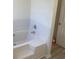 White bathtub with tile surround at 6258 Crooked Creek Dr, Rex, GA 30273