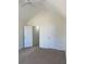 Neutral bedroom with vaulted ceiling, carpet, and white doors at 6258 Crooked Creek Dr, Rex, GA 30273
