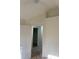 Bedroom with carpeted flooring, a ceiling fan, and view of a hallway at 6258 Crooked Creek Dr, Rex, GA 30273