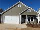 Charming single-story home with a two-car garage, complemented by stone accents and neat landscaping at 124 Sunflower Ne Cir, Cartersville, GA 30121