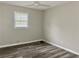 Bright bedroom with ceiling fan and wood-look floors at 4132 Scenic Mountain Dr, Snellville, GA 30039