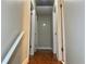 Bright hallway with hardwood floors and doors to bedrooms at 4132 Scenic Mountain Dr, Snellville, GA 30039