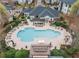 Aerial view of a community pool and lounge area surrounded by lush landscaping at 1575 Ridenour Nw Pkwy # 804, Kennesaw, GA 30152