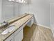 Bathroom with dual sinks, granite countertop, large mirror, and tile flooring at 1575 Ridenour Nw Pkwy # 804, Kennesaw, GA 30152