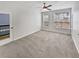 Spacious bedroom with natural light, ceiling fan, and a door to the outside deck at 1575 Ridenour Nw Pkwy # 804, Kennesaw, GA 30152