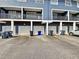 Apartment building with multiple garage doors and exterior trash cans at 1575 Ridenour Nw Pkwy # 804, Kennesaw, GA 30152