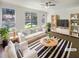 Bright living room featuring a modern striped rug, white sofa, and ample natural light from large windows at 1575 Ridenour Nw Pkwy # 804, Kennesaw, GA 30152