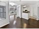 Open-concept living room with hardwood floors that connect to the kitchen at 1575 Ridenour Nw Pkwy # 804, Kennesaw, GA 30152