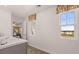 Bathroom with single vanity, view of backyard from window at 8601 Preakness Pass, Lithonia, GA 30058