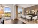 Bright dining room with hardwood floors and modern light fixtures at 8601 Preakness Pass, Lithonia, GA 30058