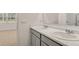 The bathroom features dual sinks, plenty of counter space, and natural light at 8588 Preakness Pass, Lithonia, GA 30058