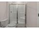 Modern bathroom with glass enclosed shower and toilet at 8588 Preakness Pass, Lithonia, GA 30058