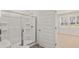 Bathroom featuring a glass shower door, toilet, and window view at 8588 Preakness Pass, Lithonia, GA 30058