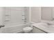 Standard bathroom includes a shower-tub combo, toilet, and vanity with sink at 8588 Preakness Pass, Lithonia, GA 30058