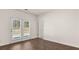 Bright bedroom with wood floors, double doors, and access to the outdoors at 8588 Preakness Pass, Lithonia, GA 30058