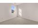 A clean and bright bedroom with a window offering plenty of natural light and plush carpet at 8588 Preakness Pass, Lithonia, GA 30058