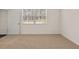 Comfortable bedroom with carpet, a window, and white walls at 8588 Preakness Pass, Lithonia, GA 30058
