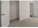 Bright bedroom with plush carpeting and an open closet space for ample storage at 8588 Preakness Pass, Lithonia, GA 30058