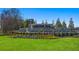 Champions Run entrance sign is surrounded by tulips and landscaped lawn at 8588 Preakness Pass, Lithonia, GA 30058