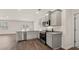 Bright, open kitchen with stainless steel appliances and bar seating at 8588 Preakness Pass, Lithonia, GA 30058