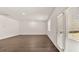 Spacious living room with wood floors and large double doors leading outside at 8588 Preakness Pass, Lithonia, GA 30058