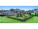 Community playground and picnic area for residents, with slides and lush green grass at 8588 Preakness Pass, Lithonia, GA 30058