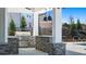 Close up of pool pavilion with stainless grill, stone countertops, and pendant lighting at 8588 Preakness Pass, Lithonia, GA 30058