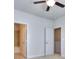 Bedroom featuring open bathroom and closet doorways at 6198 Ripple Way # 87, South Fulton, GA 30349