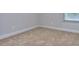 Cozy bedroom featuring neutral walls, plush carpeting, and a window for natural light at 6198 Ripple Way # 87, South Fulton, GA 30349
