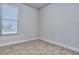 Bedroom with neutral walls, plush carpet, natural light from a window and white base trim at 6198 Ripple Way # 87, South Fulton, GA 30349