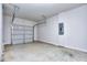 Spacious two car garage with plenty of room for storage and concrete flooring at 6198 Ripple Way # 87, South Fulton, GA 30349