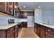 Well-lit kitchen with modern appliances, granite countertops, and ample cabinet space at 6198 Ripple Way # 87, South Fulton, GA 30349