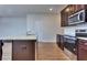 Spacious kitchen featuring modern appliances and a stylish kitchen island with granite countertops at 6198 Ripple Way # 87, South Fulton, GA 30349