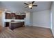 Open kitchen featuring a center island, dark cabinets, and stainless steel appliances at 6198 Ripple Way # 87, South Fulton, GA 30349