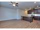 Kitchen featuring a center island, dark cabinets, and stainless steel appliances in an open room at 6198 Ripple Way # 87, South Fulton, GA 30349