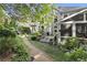 Landscaped backyard with a gravel path, mature trees, and a screened porch perfect for relaxation and entertaining at 4055 Vinings Mill Se Trl, Smyrna, GA 30080