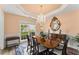 Elegant dining room features a chandelier, large mirror, and plenty of natural light at 4055 Vinings Mill Se Trl, Smyrna, GA 30080