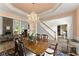 Open-concept dining room with hardwood floors, a chandelier, and views into the living room at 4055 Vinings Mill Se Trl, Smyrna, GA 30080
