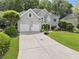 Charming home with a lush green lawn, a two-car garage, and plenty of driveway space at 4055 Vinings Mill Se Trl, Smyrna, GA 30080