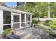 Charming screened in patio with comfortable seating and access to the lush backyard at 4055 Vinings Mill Se Trl, Smyrna, GA 30080