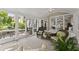 Comfortable sunroom featuring large windows and a ceiling fan for relaxation at 4055 Vinings Mill Se Trl, Smyrna, GA 30080
