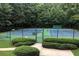 Community tennis courts showcasing well-maintained courts, surrounded by green landscaping at 4055 Vinings Mill Se Trl, Smyrna, GA 30080
